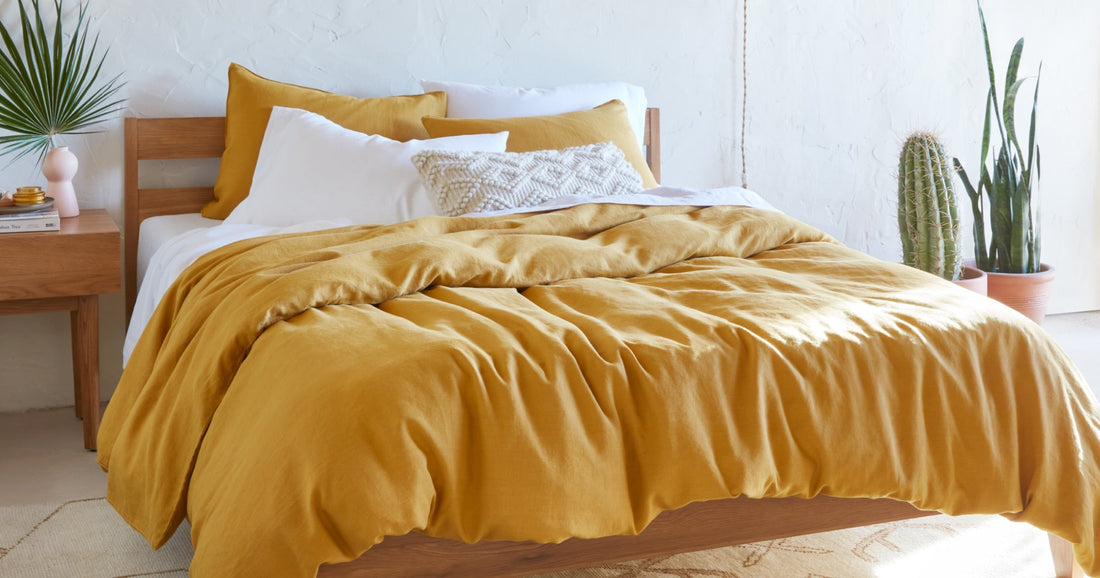 Tuft & Needle bed made with white and gold bedding