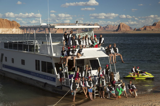 Tuft & Needle Team hanging out on a house boat and posing for a picture during a team building activity