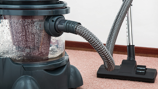 Picture of a black floor and wet vacuum