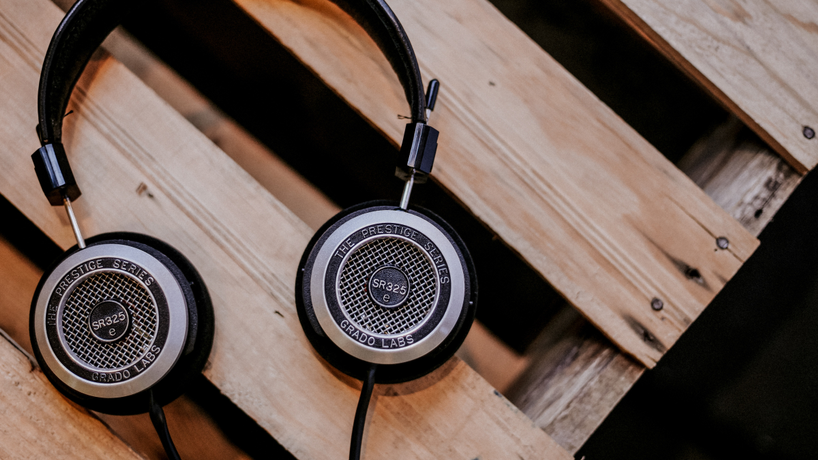 Vintage headphone sitting on top of a wood crate