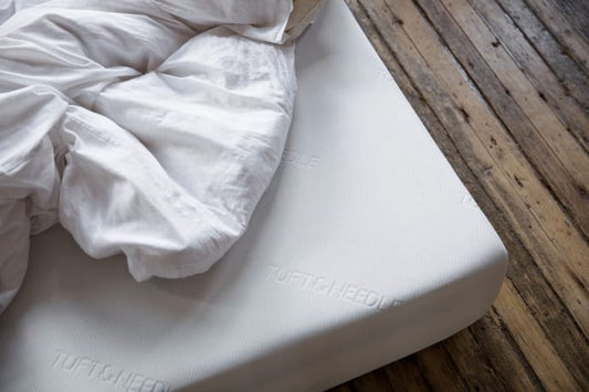 Original Mattress with white sheets