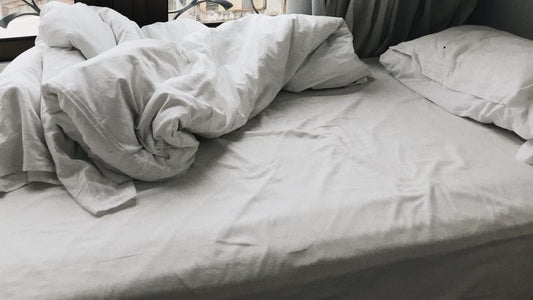 bed with white sheets