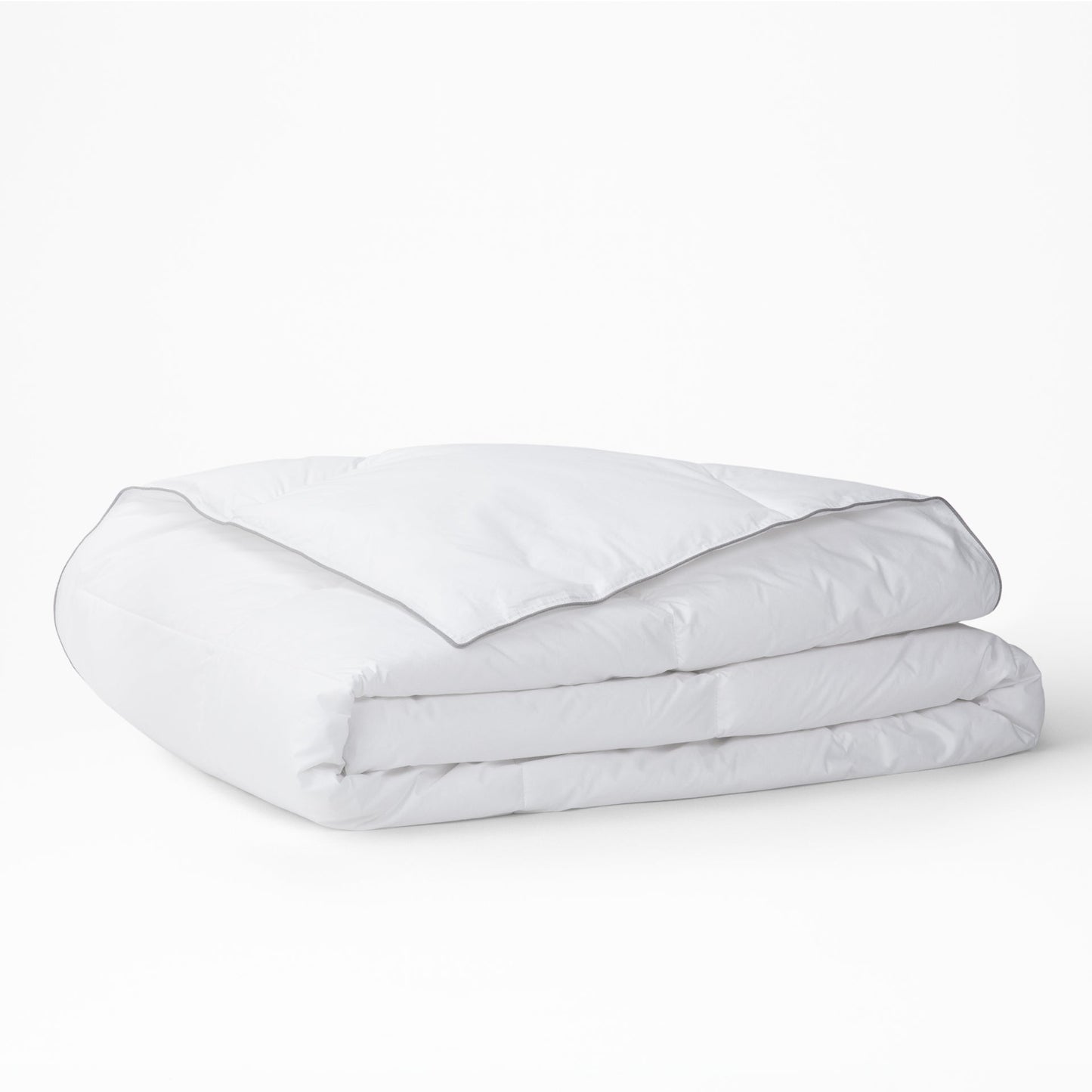 The Tuft and Needle Alternative Duvet Insert folded on a white background||weight:light