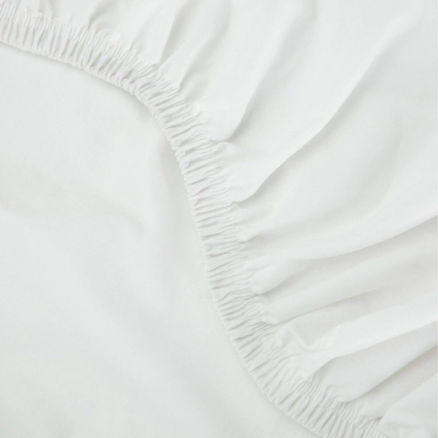 Close up of a tuft and needle mattress protector