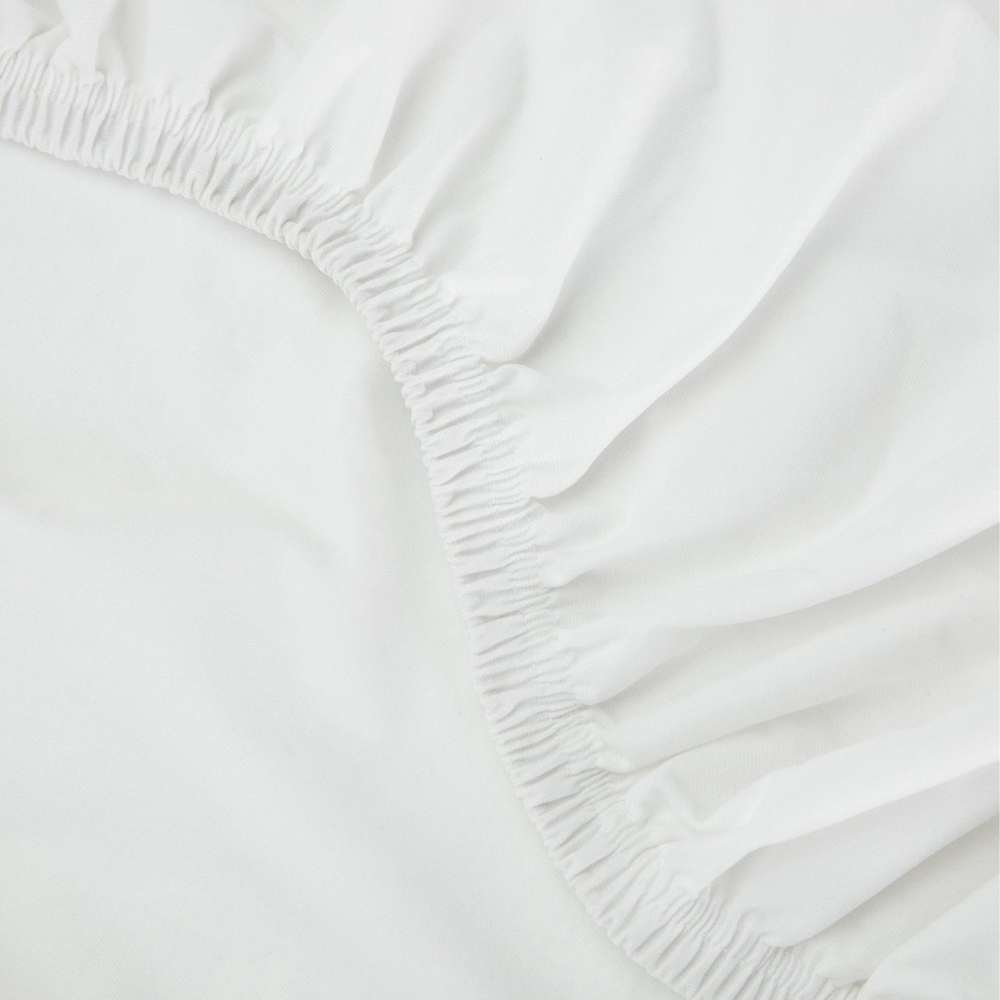Close-up view of the elastic on the Tuft and Needle Mattress Protector