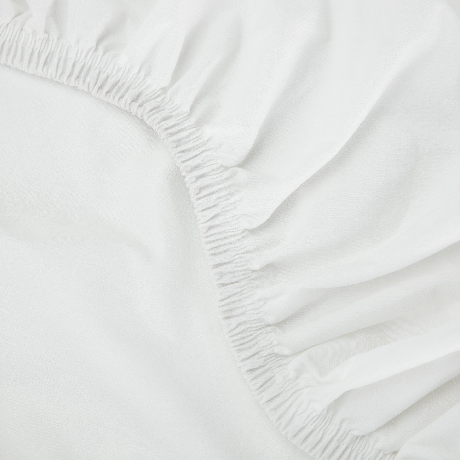 Close-up view of the elastic on the Tuft and Needle Mattress Protector
