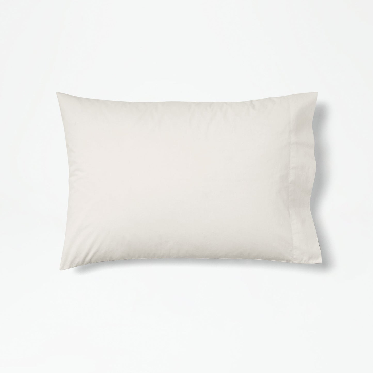 The Tuft and Needle Percale Pillowcase Set on one pillow||color:sand