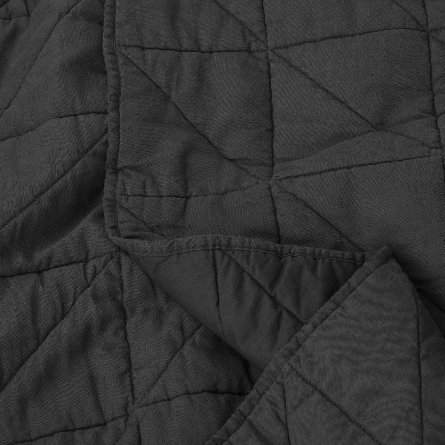 Close-up view of the fabric on the Tuft and Needle Quilt||color:charcoal
