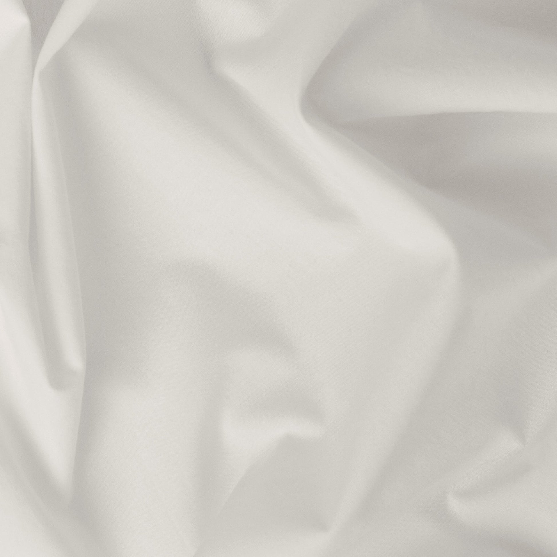 Close-up view of the fabric on the Tuft and Needle Percale Pillowcase Set||color:sand