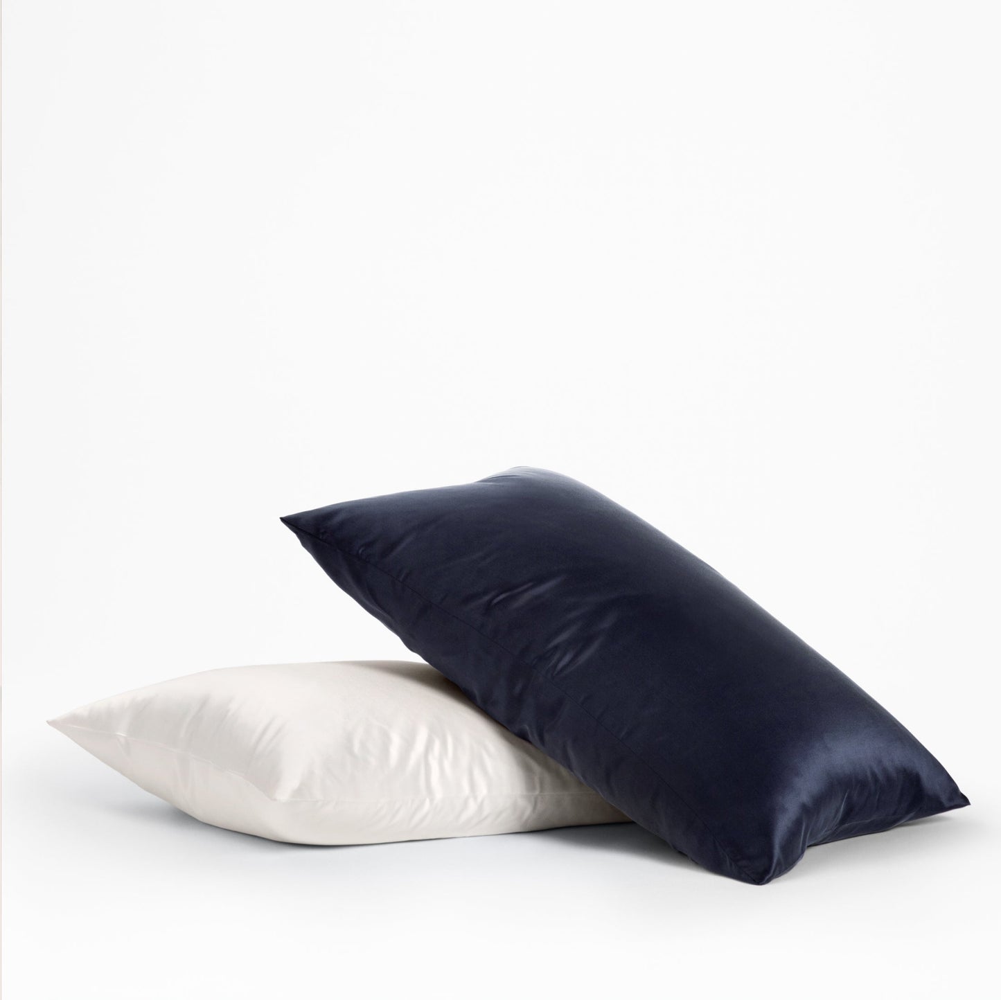 The Tuft and Needle Silk Pillowcase on 2 pillows ||color:midnight