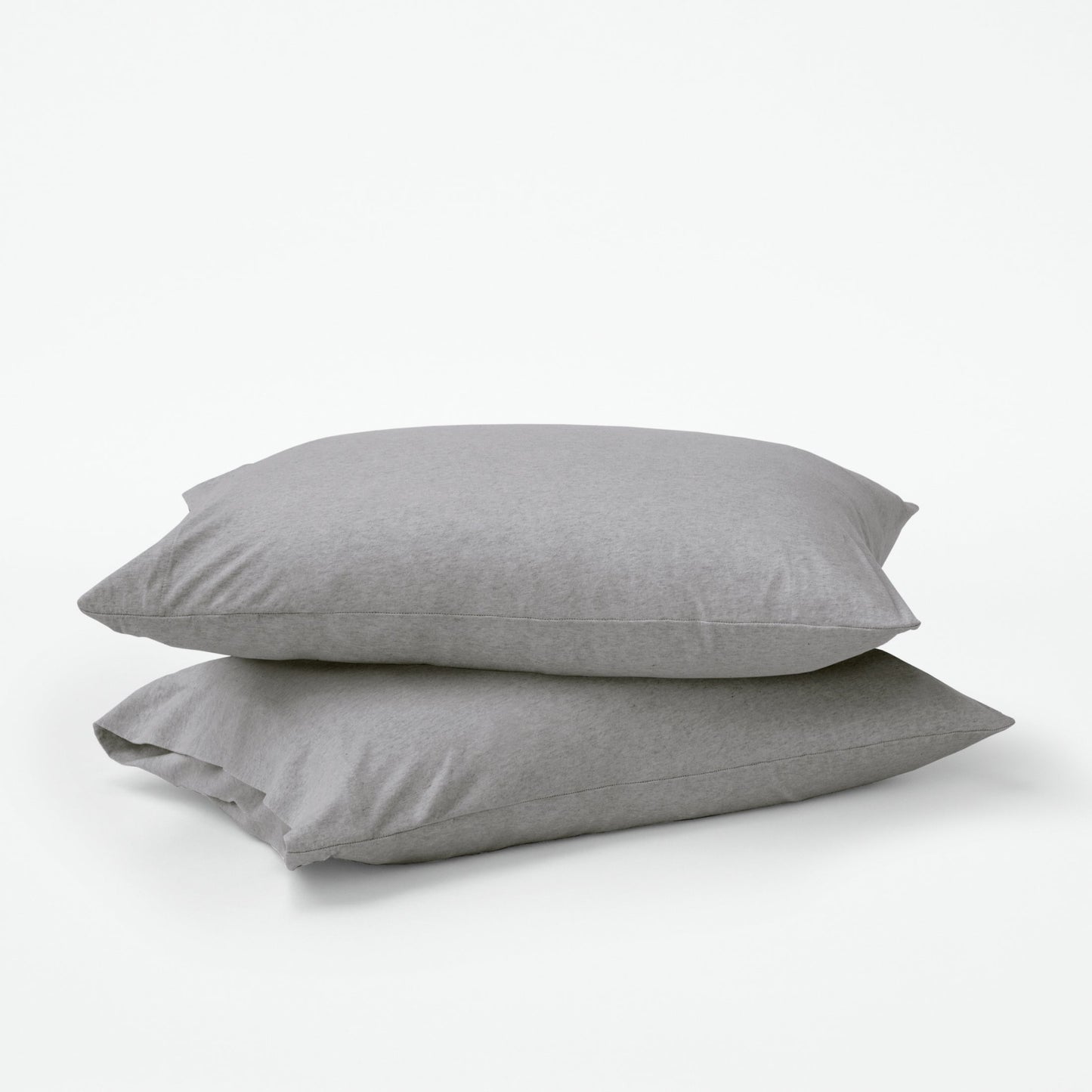 Stacked pillows with grey pillow cases
