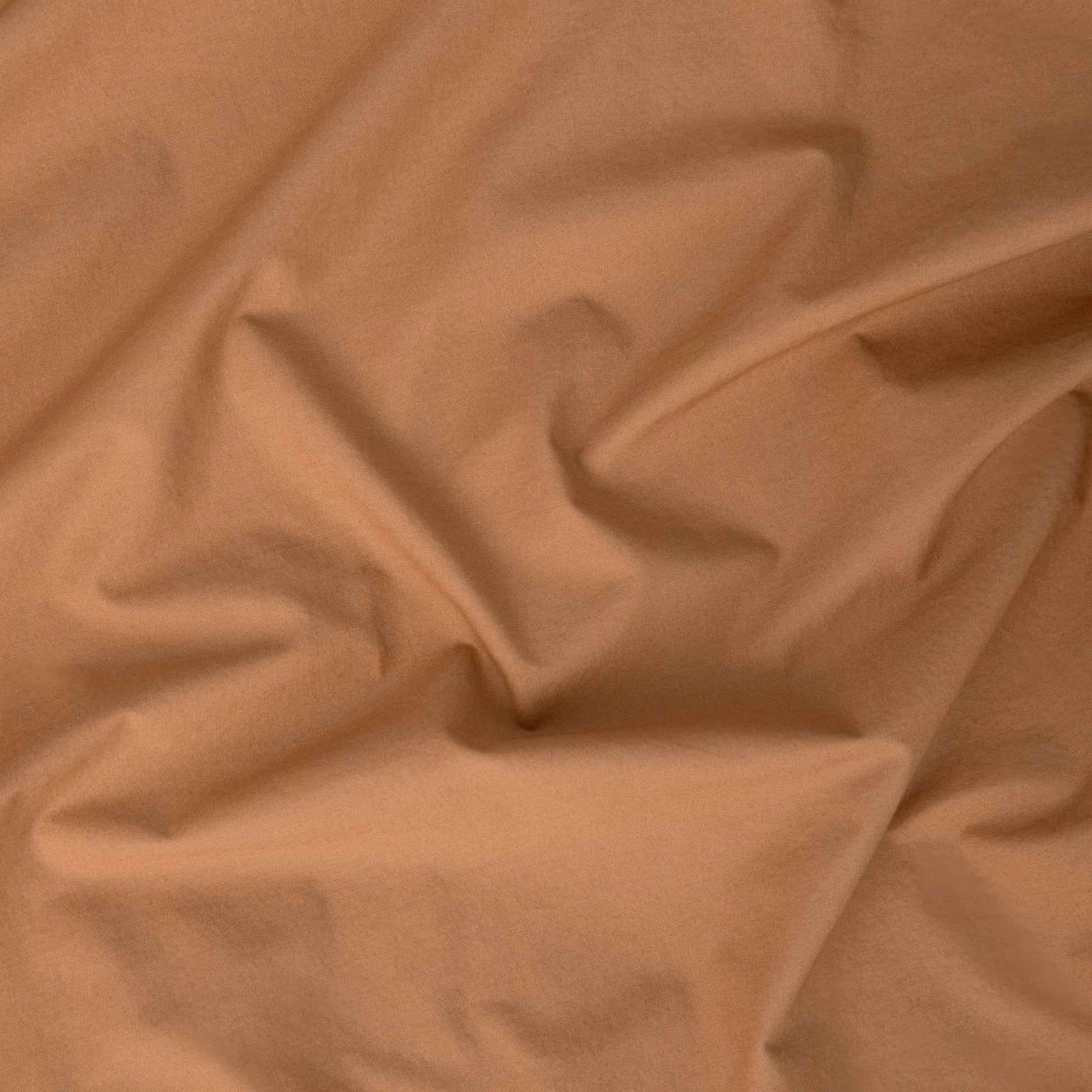 Close-up view of the fabric on the the Tuft and Needle Percale Duvet Cover Set||color:canyon