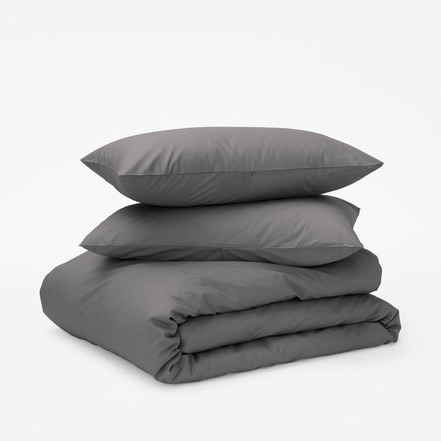 The Tuft and Needle Classic Percale Duvet Set, two pillows stacked on top of a sheet set || color: Gray Quill