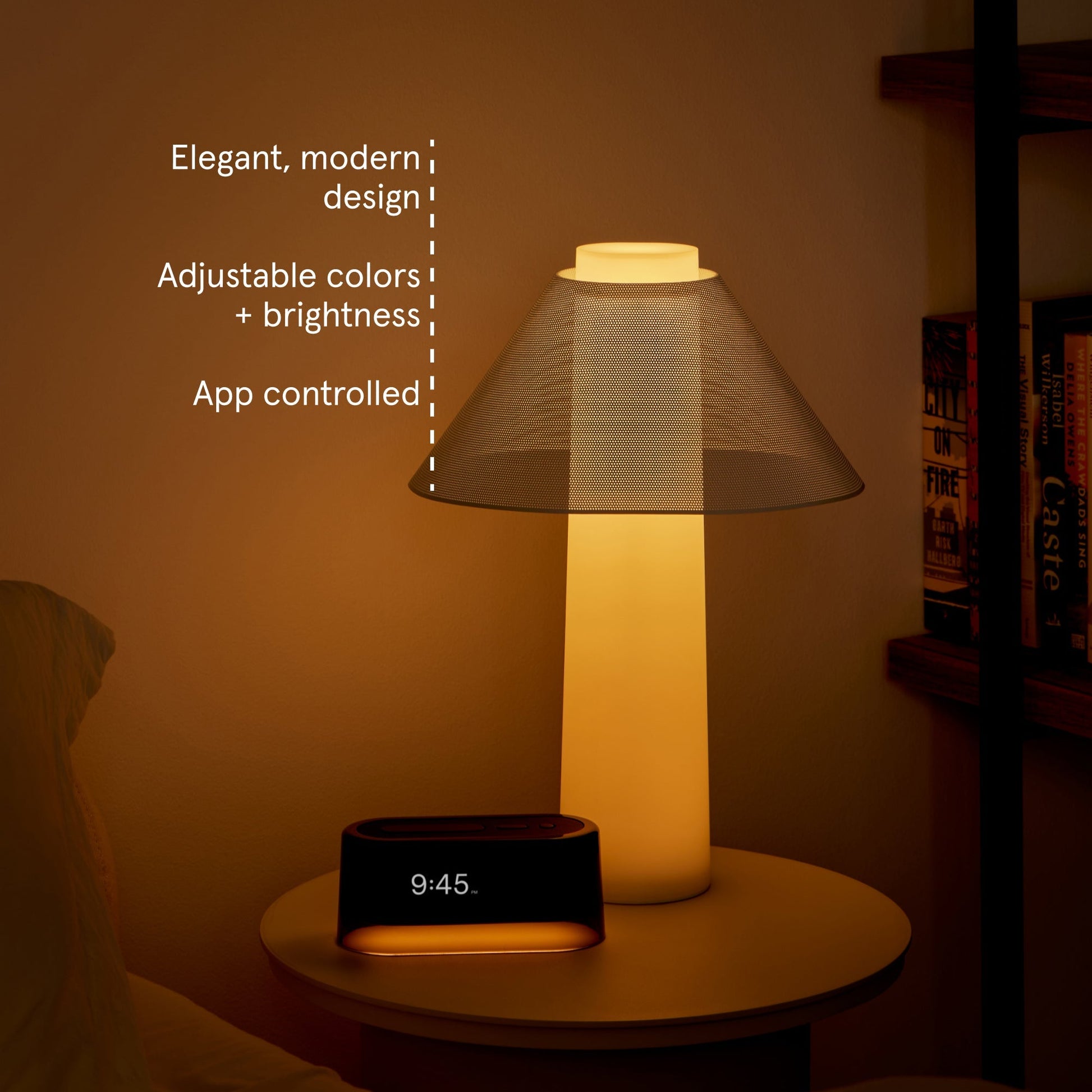 Loftie Lamp siting on a end table in back of a Loftie Smart Alarm Clock with the caption Elegant, modern design. Adjustable colors + brightness.  App controlled.