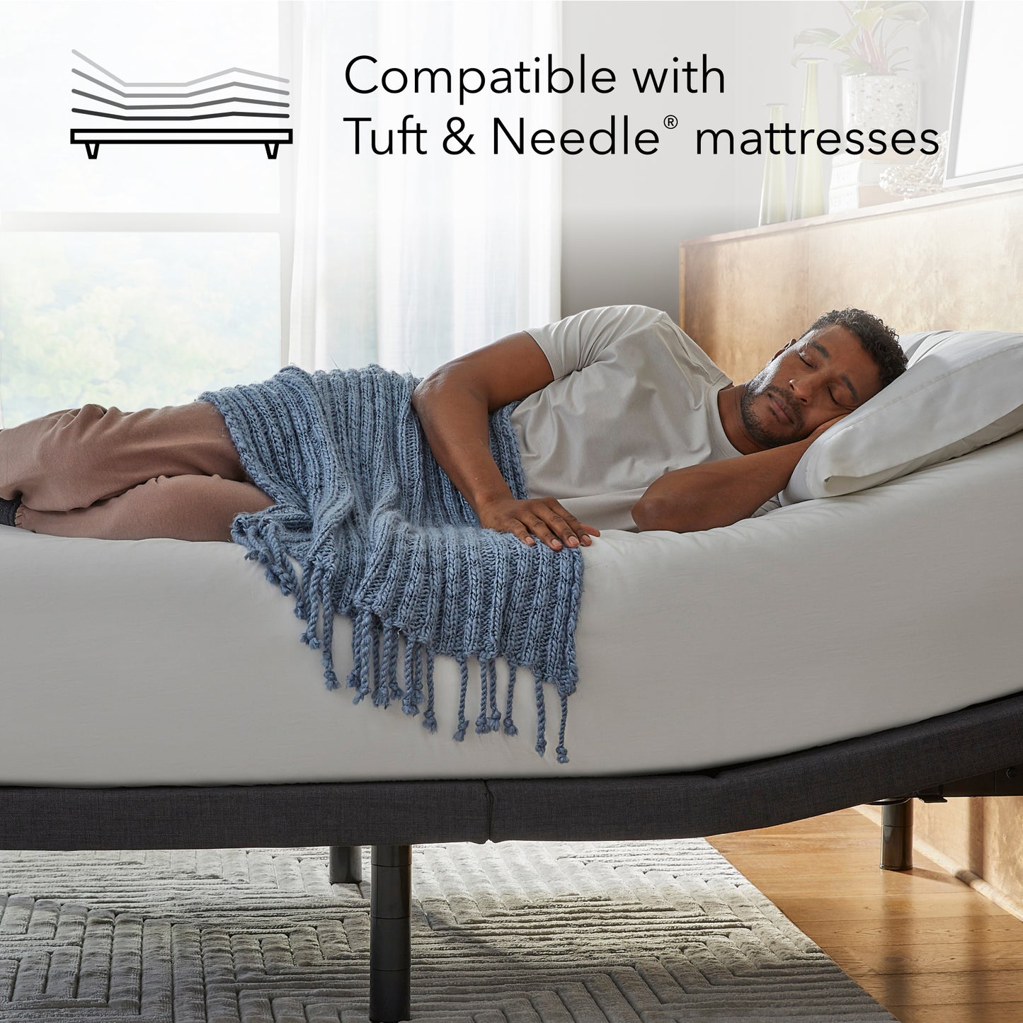 Man laying asleep on a white mattress sitting on a Baselogic Platinum Adjustable Base || level: Platinum