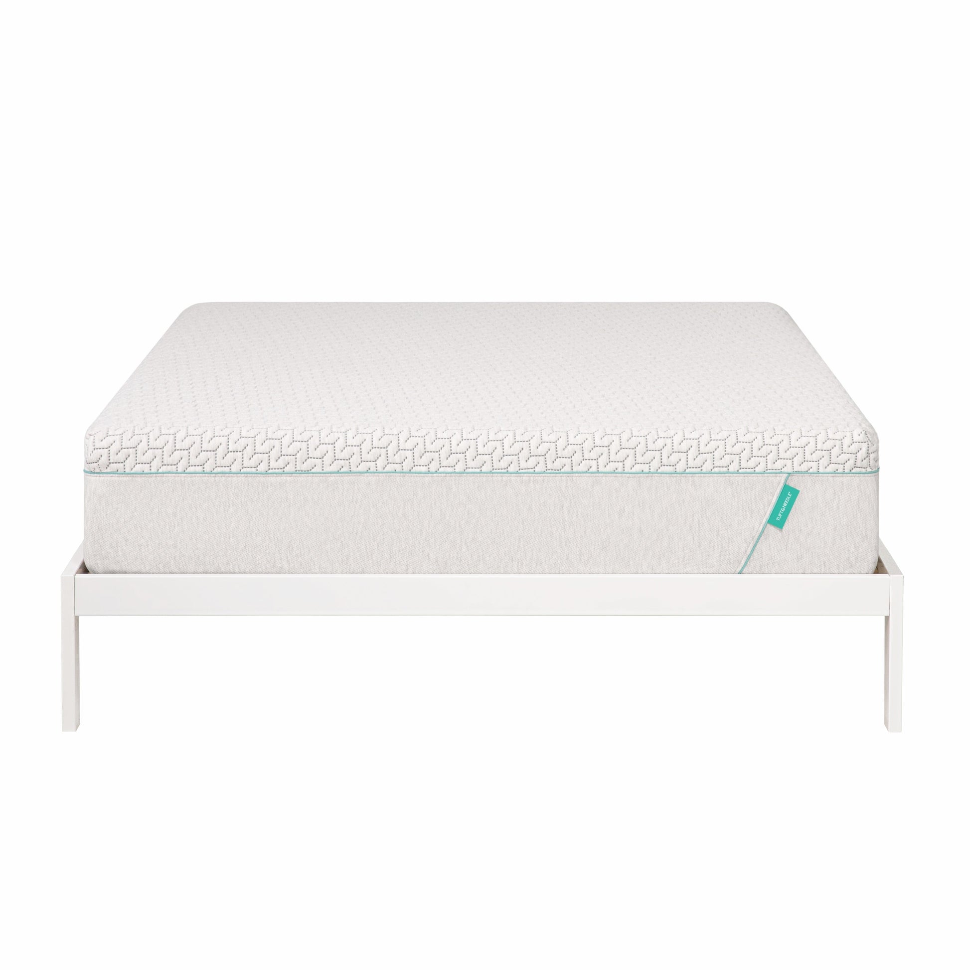 Hybrid mattress sits on white bed frame.