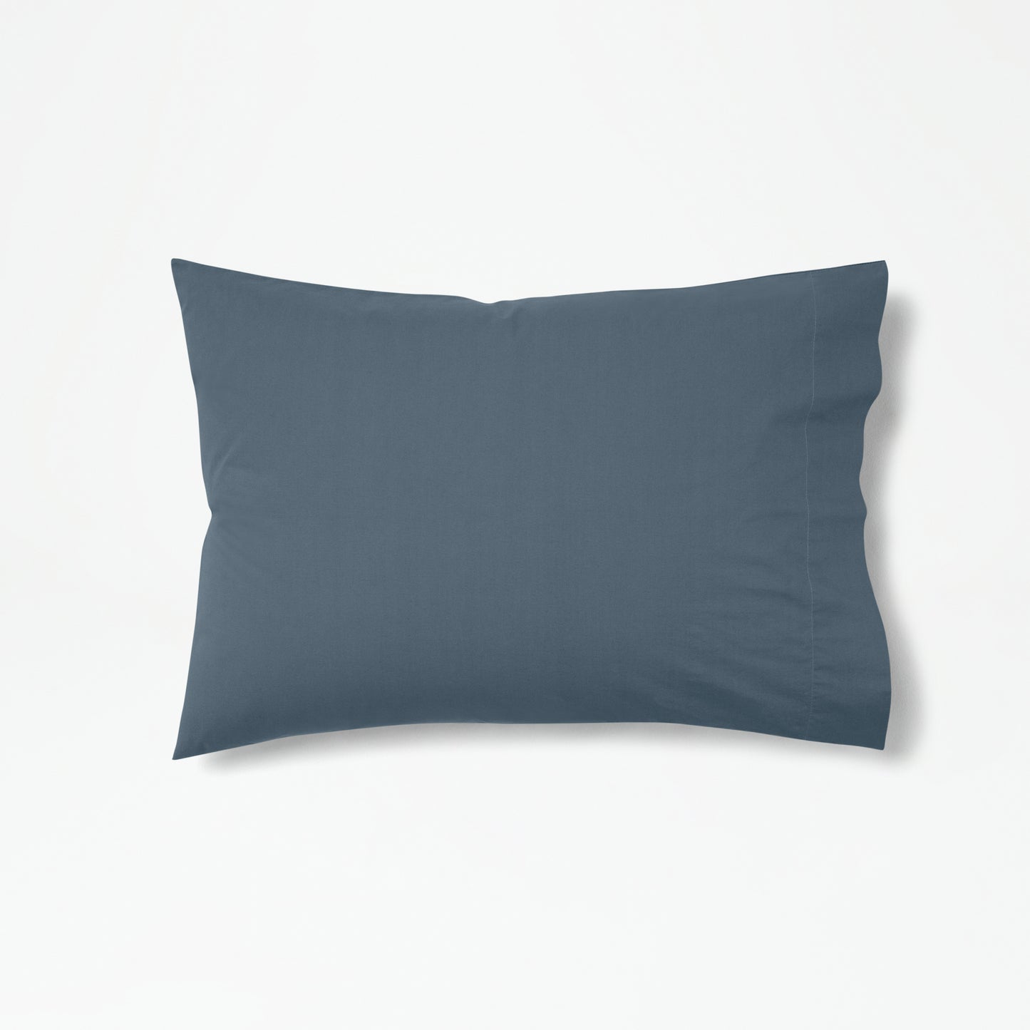 The Tuft and Needle Percale Pillowcase Set on one pillow ||color:slate