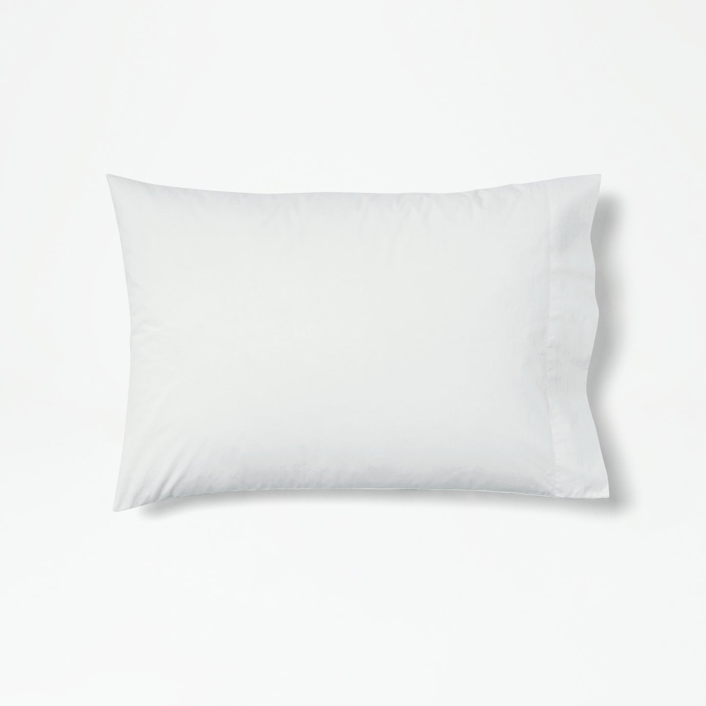 The Tuft and Needle Percale Pillowcase Set on one pillow||color:glacier