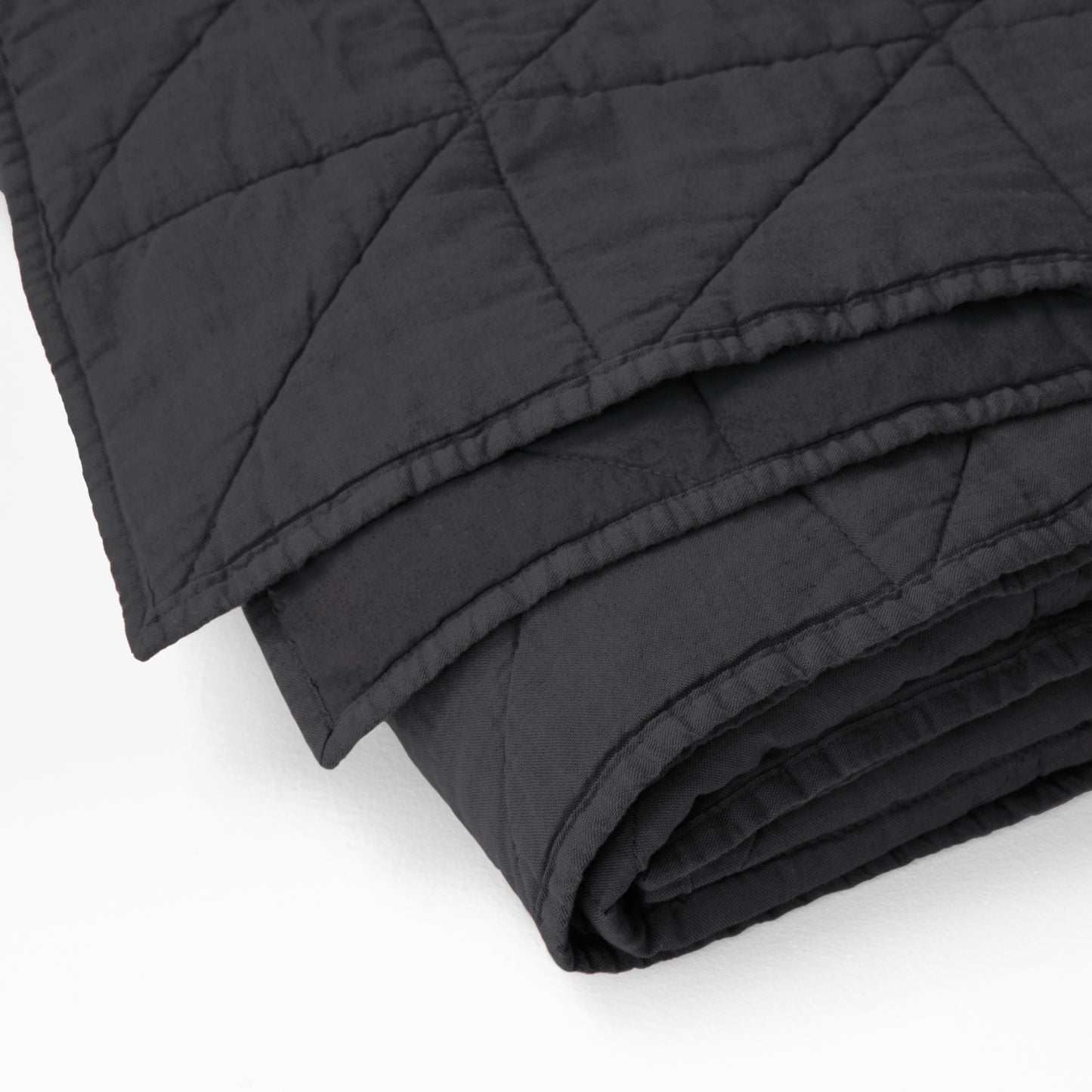 Corner detail of the Tuft and Needle Quilt||color:charcoal