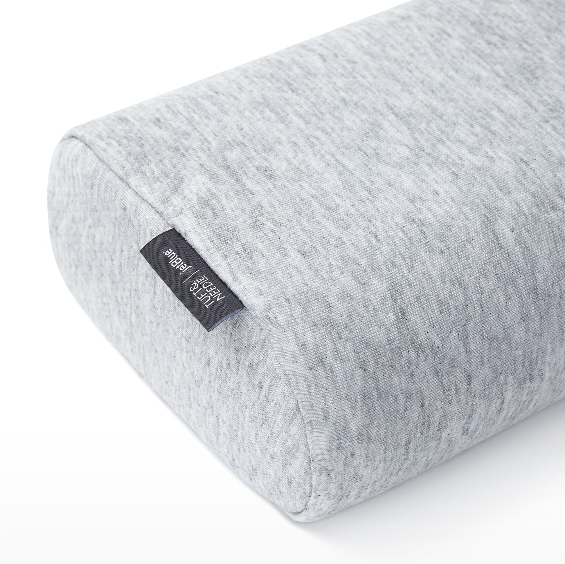 Close-up corner view of the Tuft and Needle Anywhere Travel pillow||color:granite