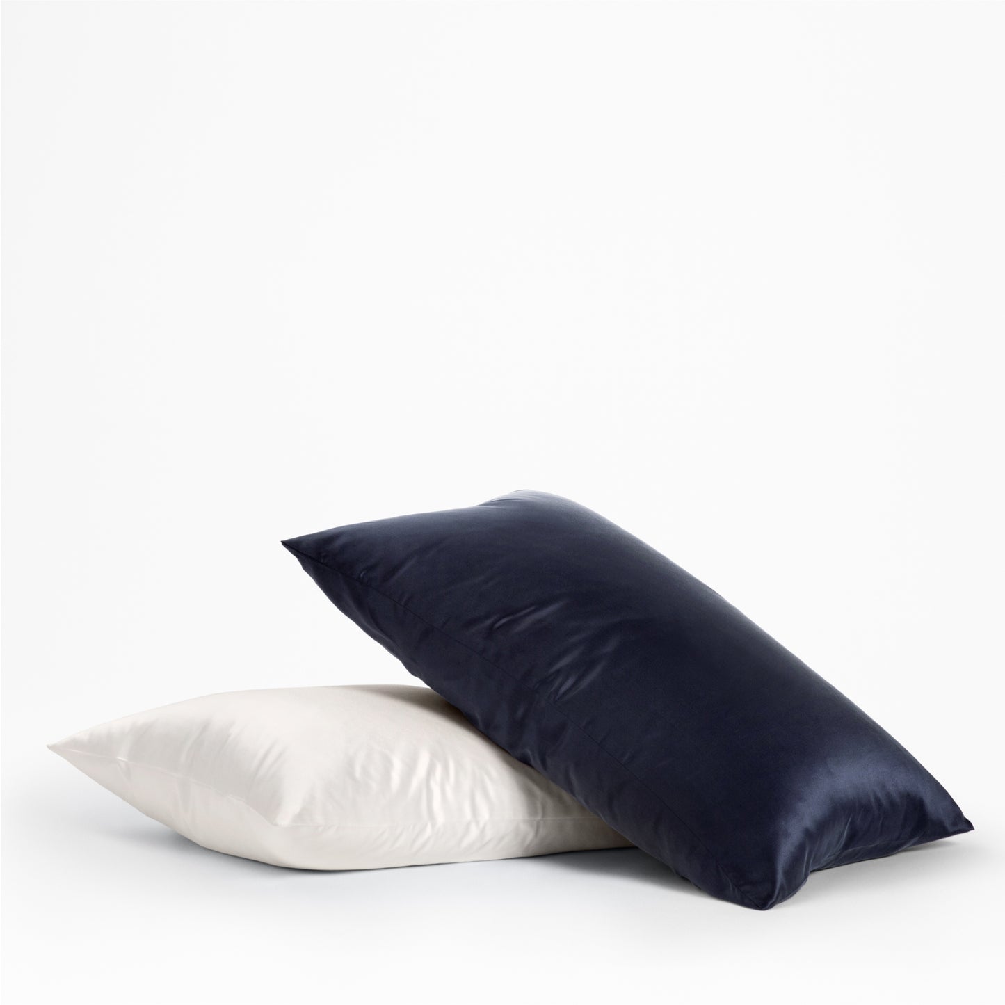 The Tuft and Needle Silk Pillowcase on 2 pillows ||color:midnight
