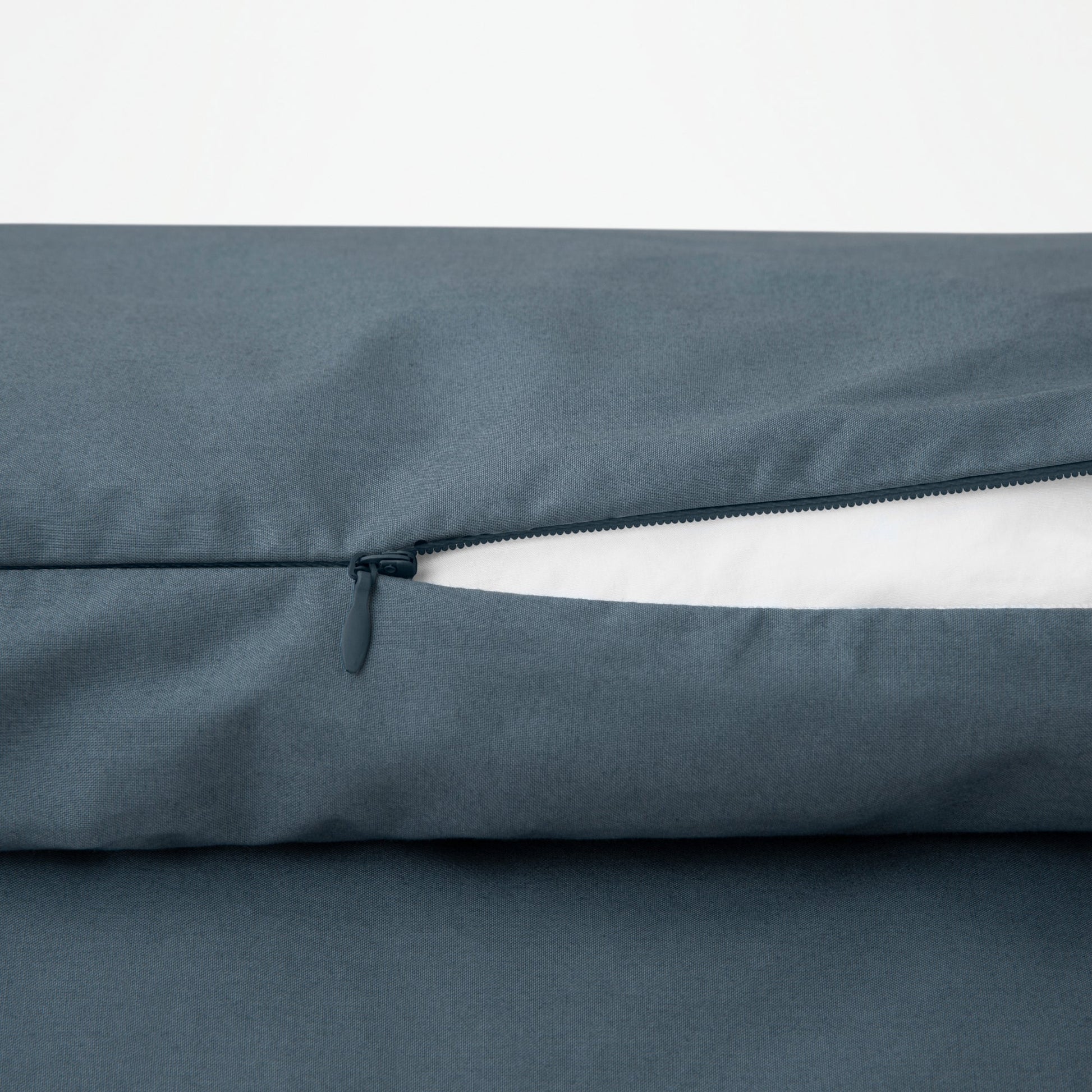 Close-up view of the zipper on the Tuft and Needle Percale Duvet Cover Set ||color:slate