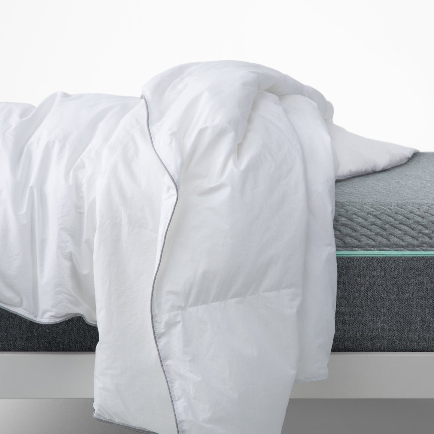 The Tuft and Needle Down Duvet Insert on a bed||weight:medium