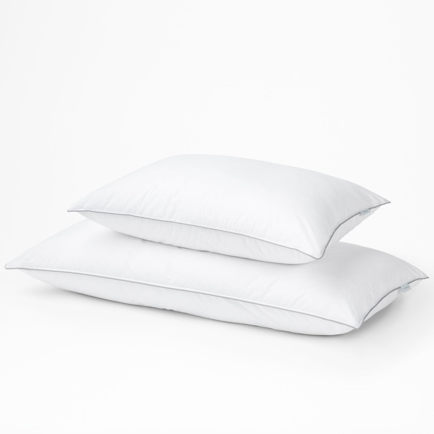Two stacked pillows with the Tuft and Needle Down Alternative Pillow Set