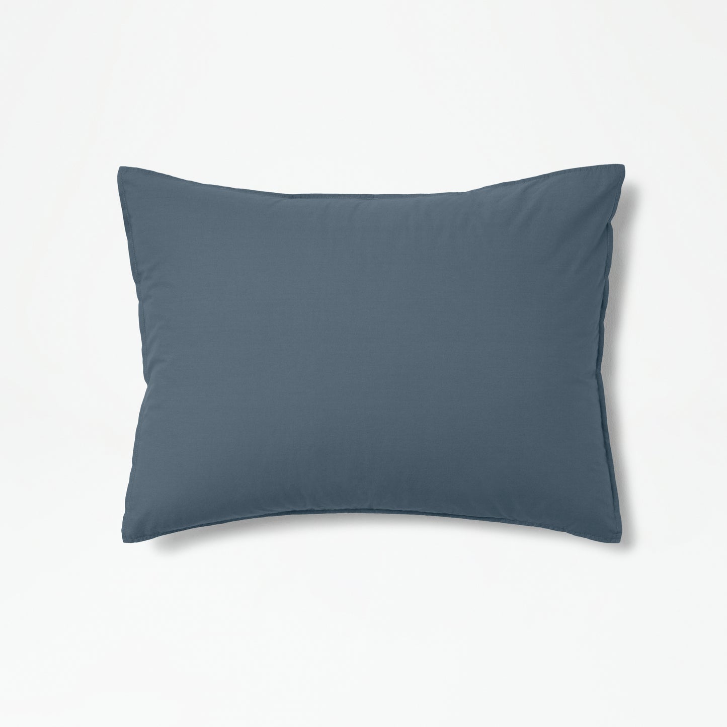 The Tuft and Needle Percale Duvet Cover Set on a pillow ||color:slate