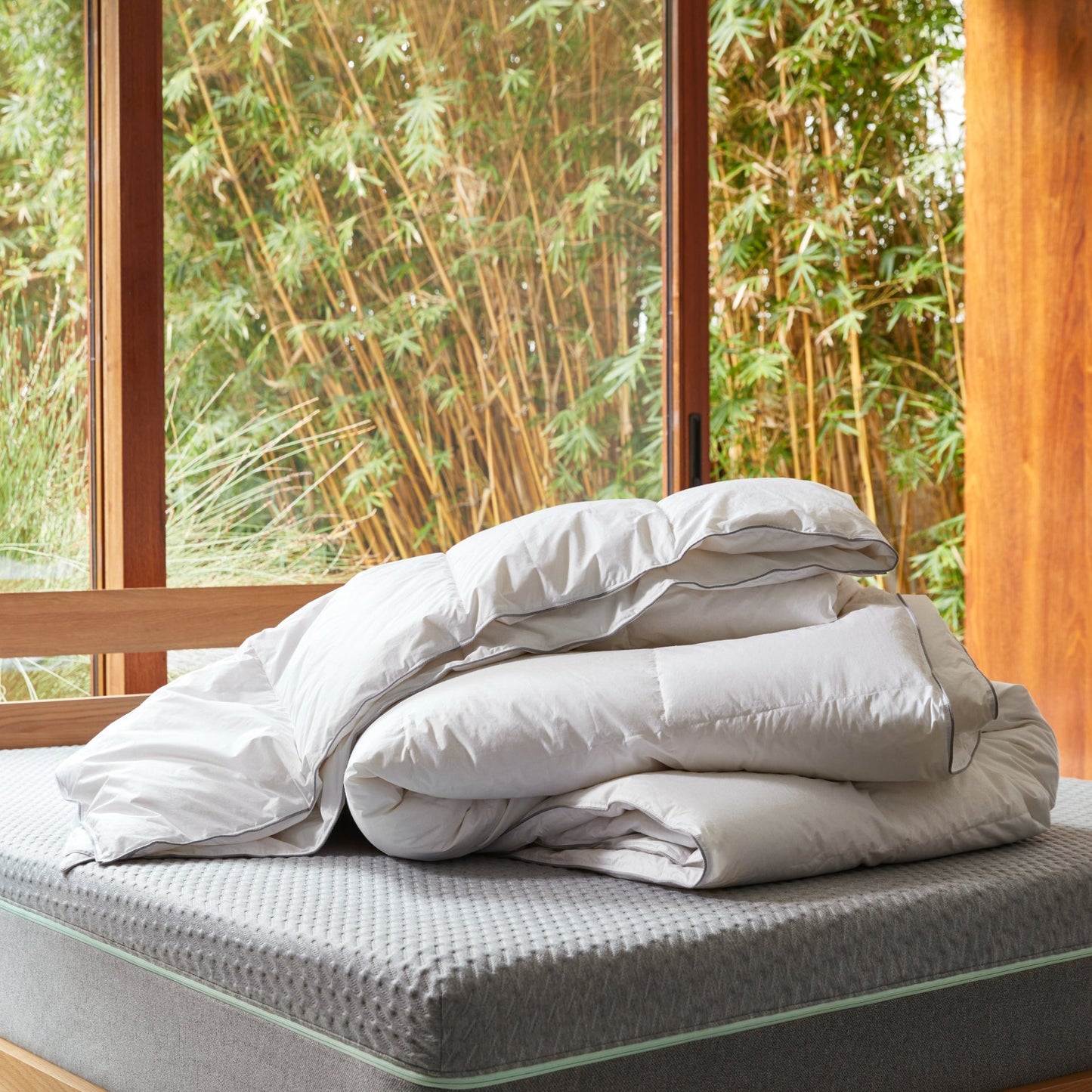 The Tuft and Needle Alternative Duvet Insert on a bed in a bedroom||weight:medium