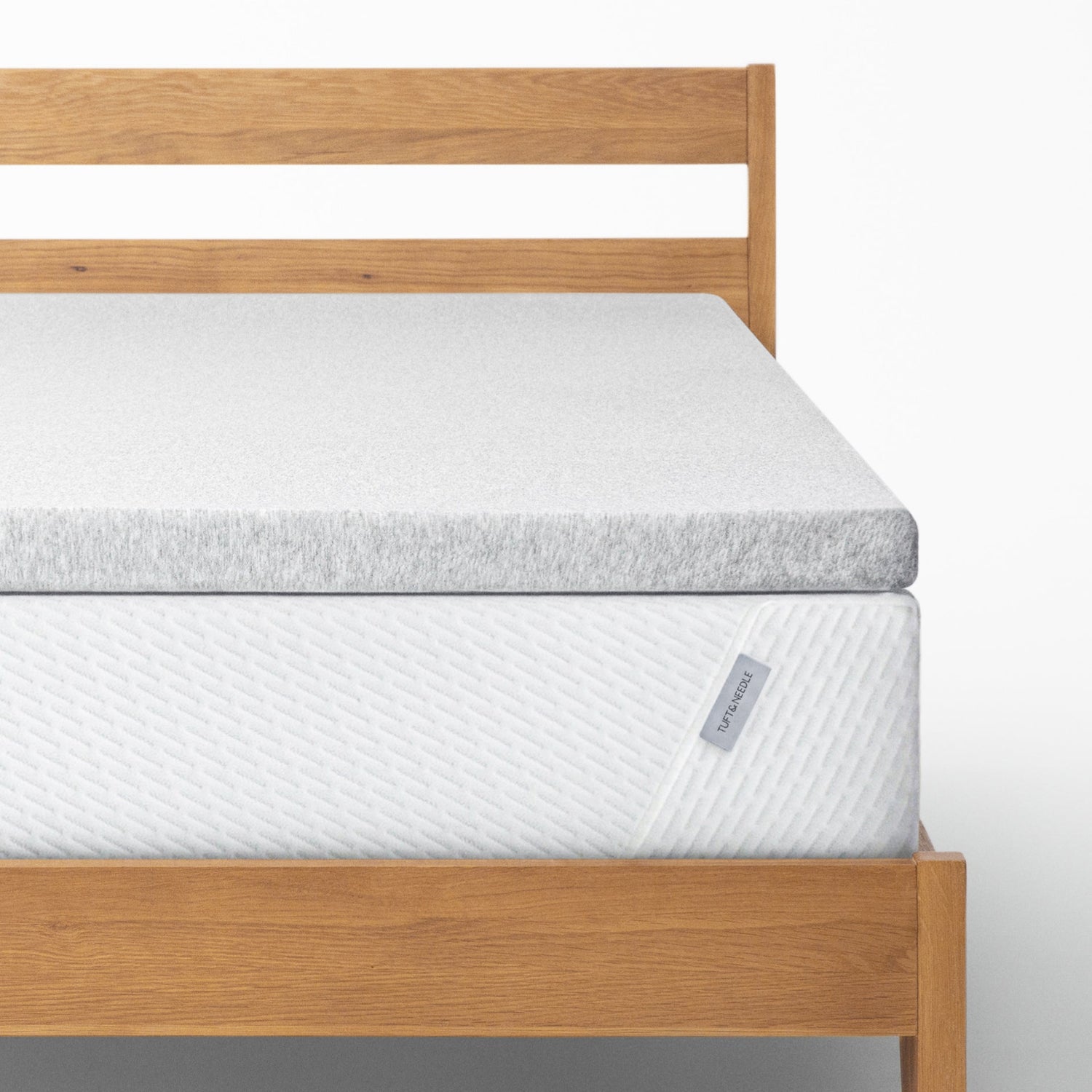 The Tuft and Needle Mattress Topper on a bed