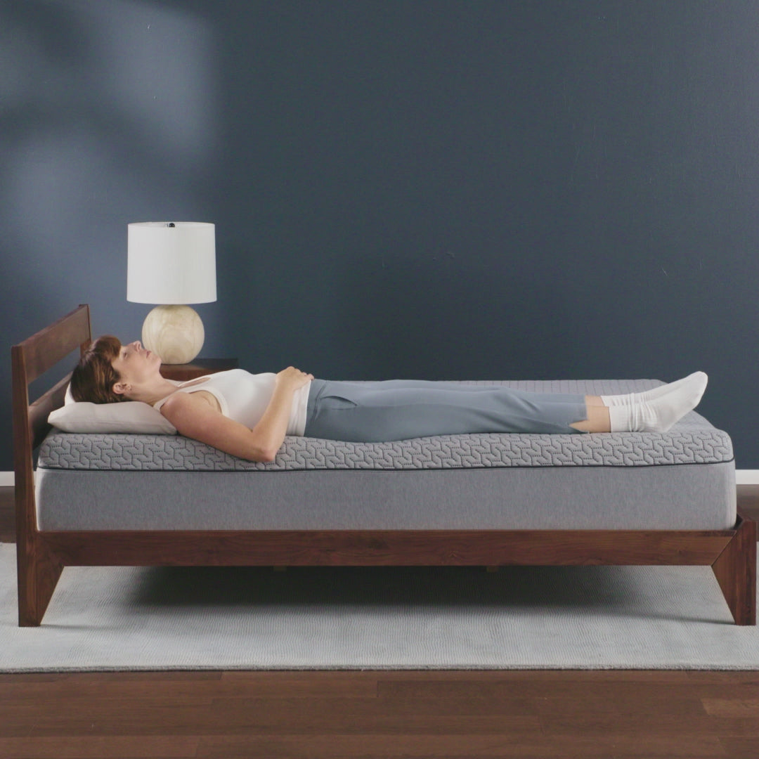 Tuft & Needle Mint Mattress short video showing a woman laying on her back the turning onto her left side