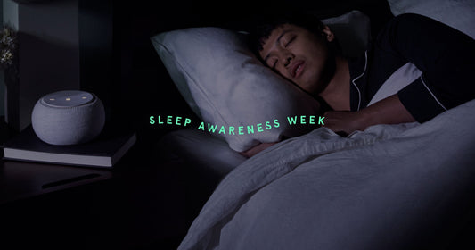 Person sleeping on their side in a Tuft & Needle bed for Sleep Awareness Week