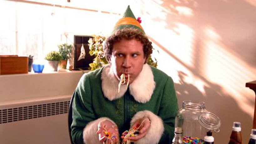 Picture from the movie Elf, where Buddy the Elf is eating candy and spaghetti