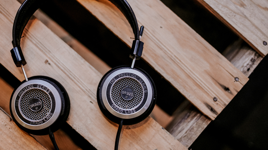 Vintage headphone sitting on top of a wood crate