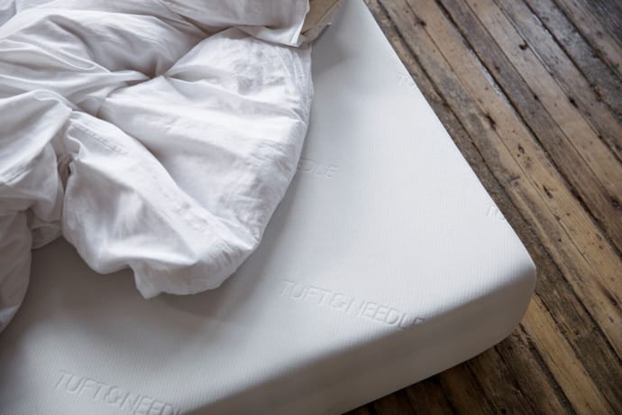 Original Mattress with white sheets