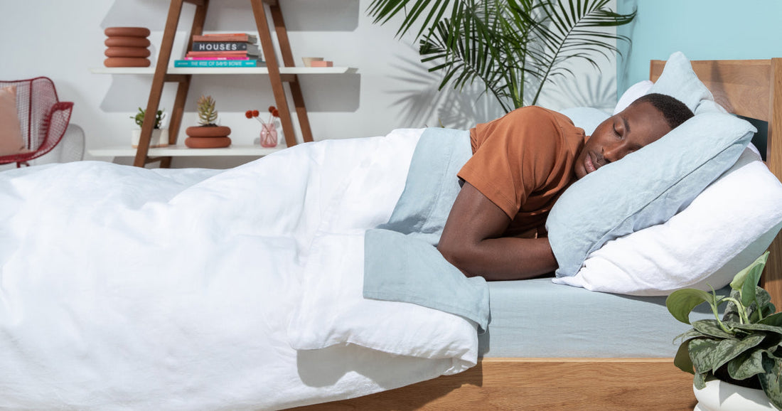 College student sleeping in a Tuft & Needle made bed