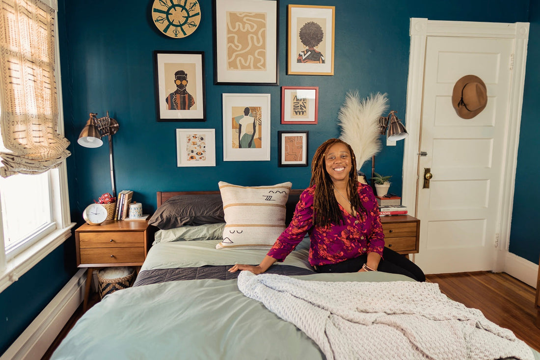 Instagramer & Interior Designer Angela Belt sits on her Tuft & Needle bed