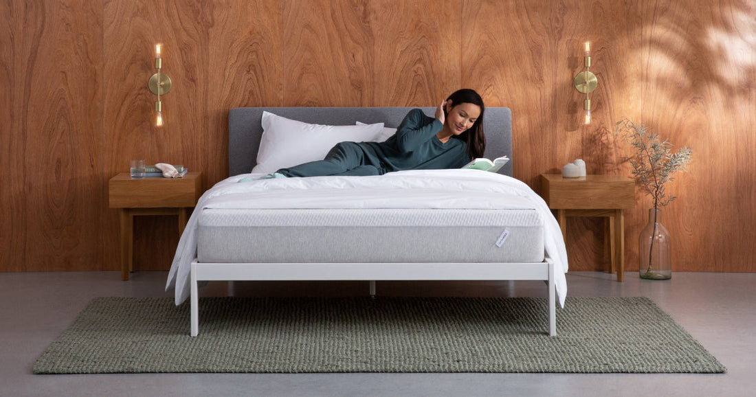 Woman reading a book on a T&N Bed