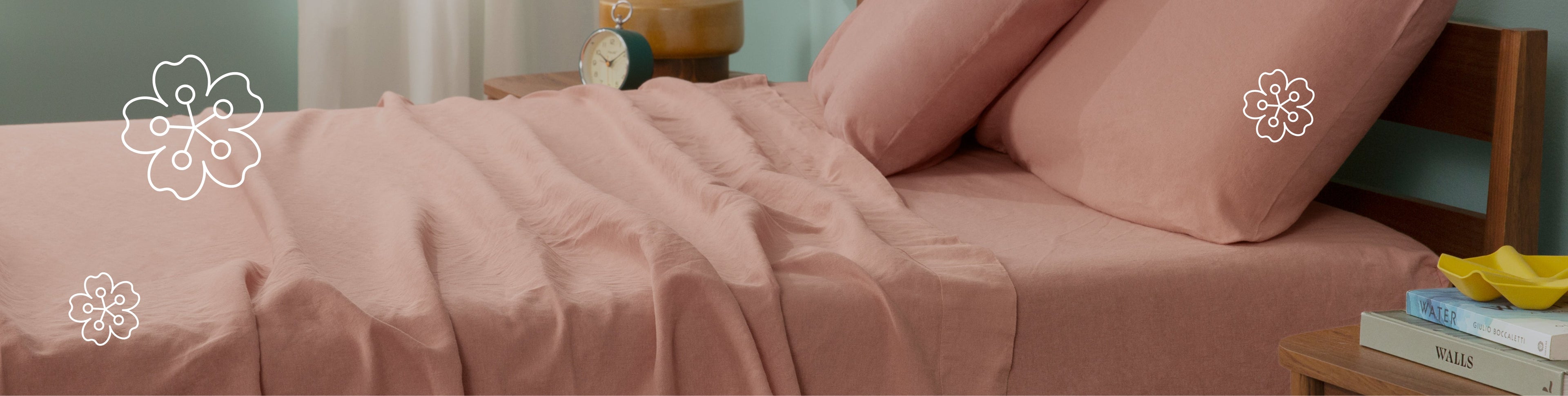 Tuft and Needle pink bedding on a Tuft and Needle mattress with two pillows on top