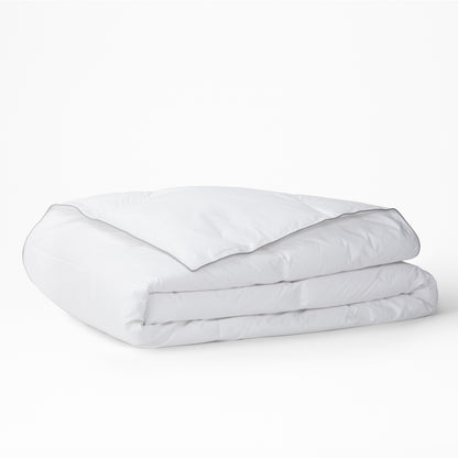 The Tuft and Needle Alternative Duvet Insert folded on a white background||weight:medium