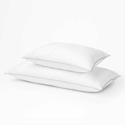 Two tuft and needle down alternative pillows, standard on top and large on the bottom