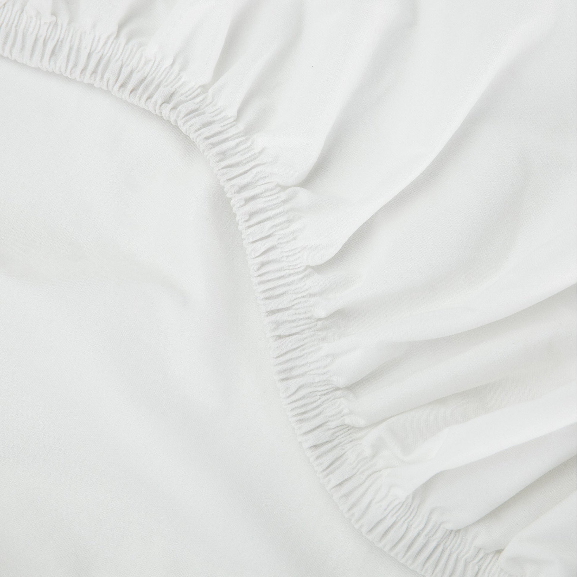 Close up of a tuft and needle mattress protector