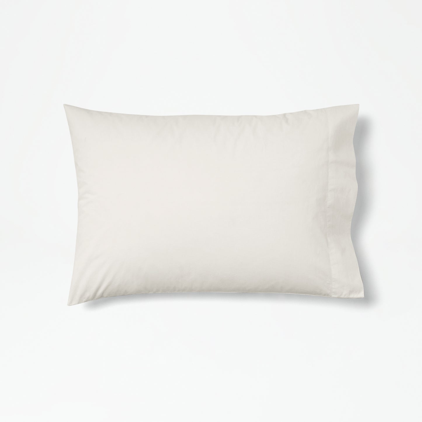 The Tuft and Needle Percale Pillowcase Set on one pillow||color:sand