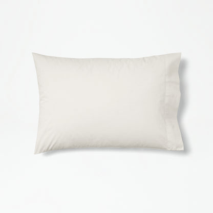 The Tuft and Needle Percale Pillowcase Set on one pillow||color:sand