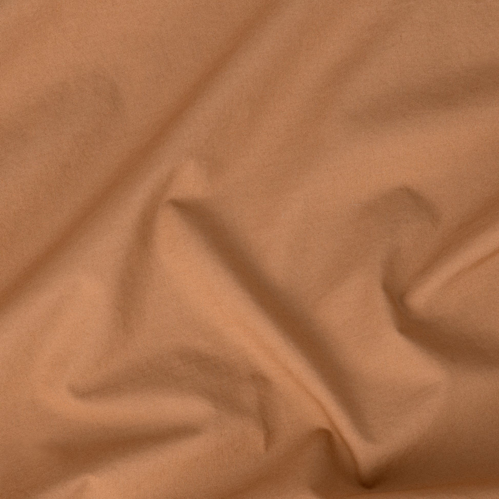 Close-up view of the fabric on the Tuft and Needle Percale Pillowcase Set||color:canyon