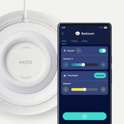 White Snooz device with smartphone displaying app interface on a light gray background