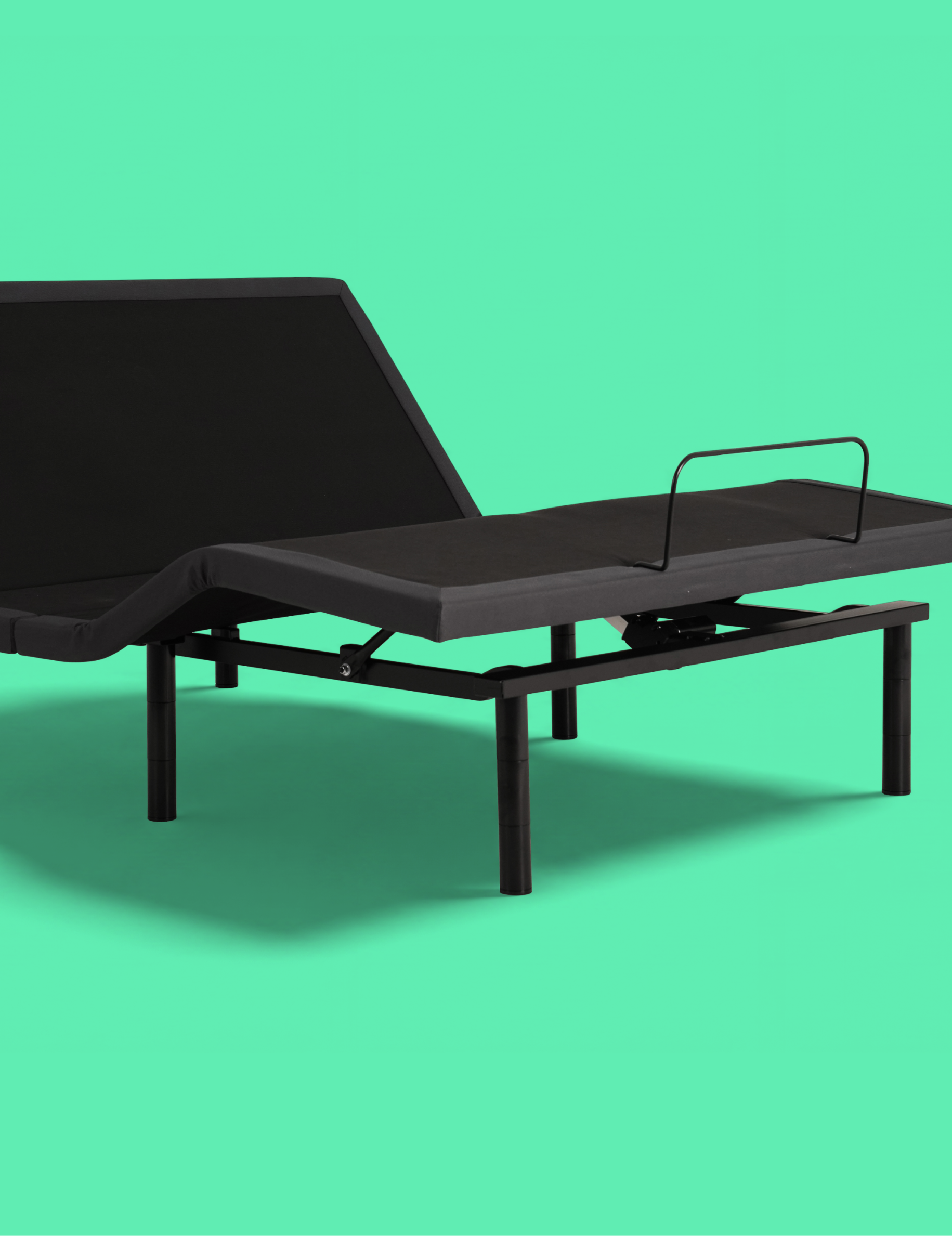 An adjustable electric bed frame with a black adjustable mattress base and side rail, shown against a solid mint green background.