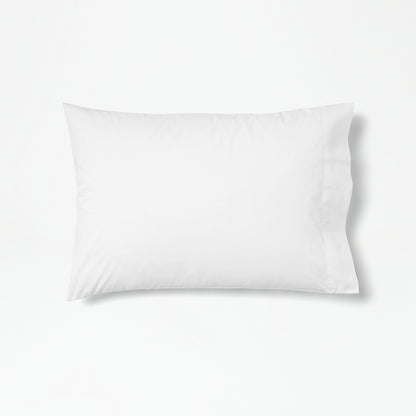 The Tuft and Needle Percale Pillowcase Set on one pillow||color:cloud