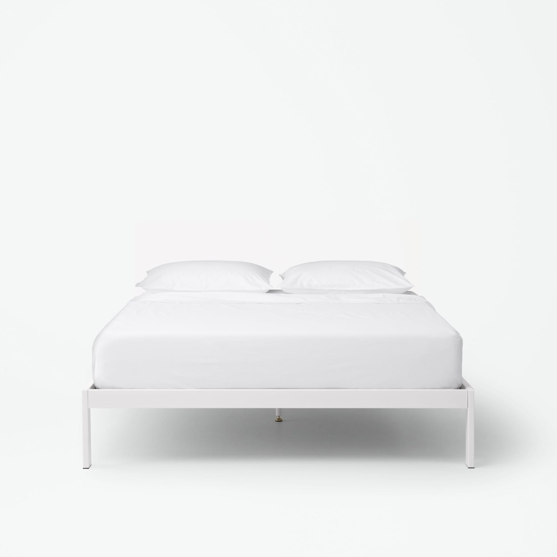 The Tuft and Needle Essential Platform Bed Frame with a mattress||color:white